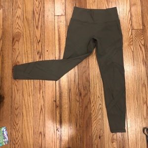 Military green Lululemon leggings with mesh cutout